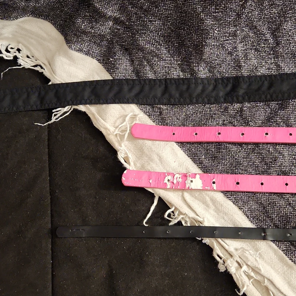 4 used belts printed pink and solid black